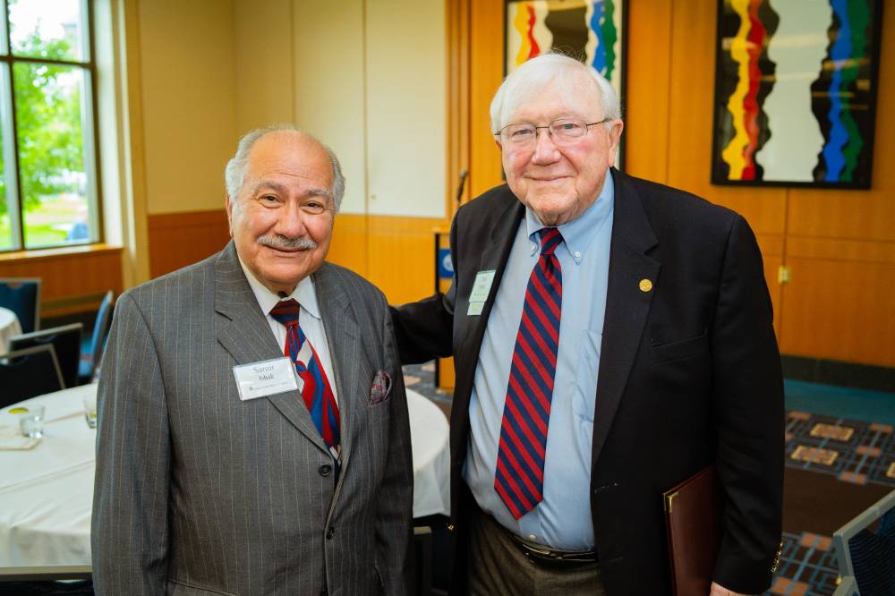 President Emeritus Don Lubbers posing with Samir Ishak at the Retiree Reception.